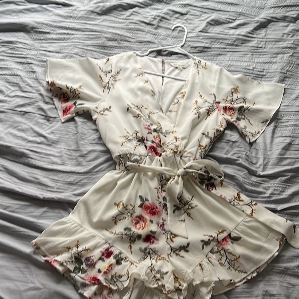 White floral romper with flutter detailing